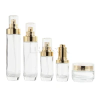 5pcslot high grade gold plated cover transparent glass press dropper lotion bottles cream jars cosmetic packaging containers