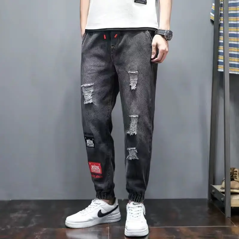 

Summer men's denim trousers elastic waist large size harem pants loose stitching all-match nine-point pants