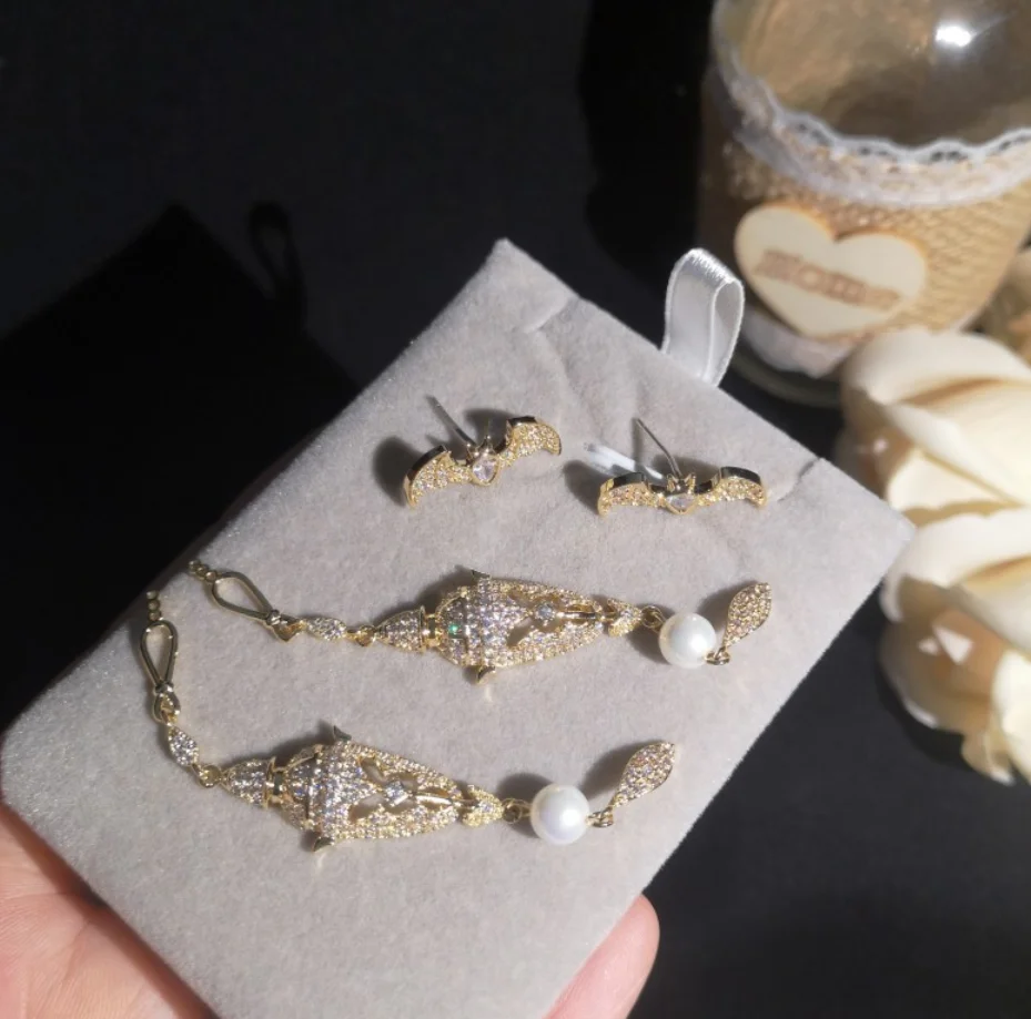

Exaggerated golden yellow zircon pearl bat lotus long earrings women temperament elegant ladies vintage hyperbole eardrop