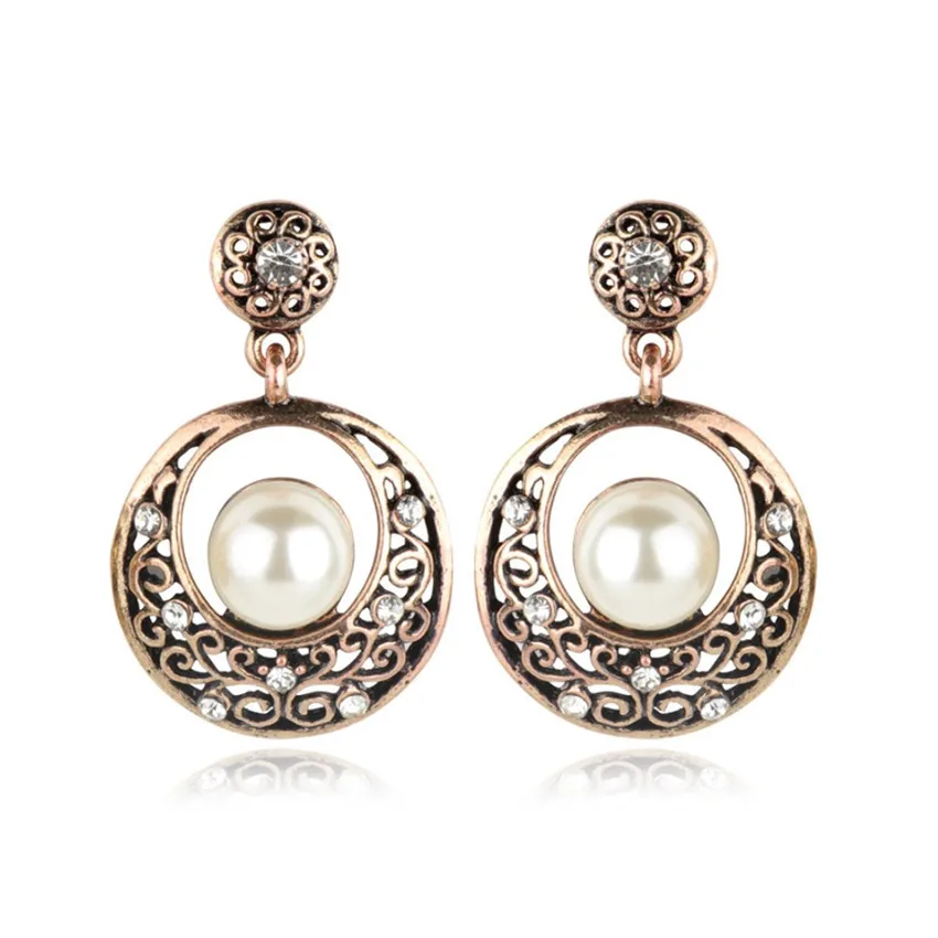 

FYJS Unique Gold Color Round Hollow with Pearls Stud Earrings for Women Vintage Style Jewelry