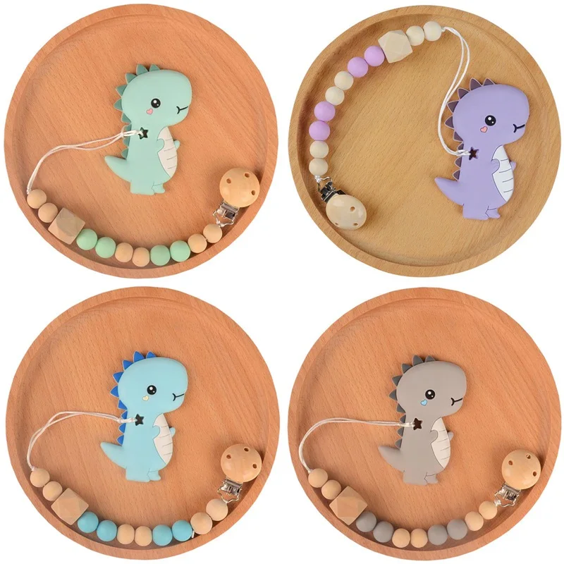 

Baby Pacifier Clip Chain Cartoon Dinosaur Silicone Teether Wooden Beads Dummy Clip Soother Chew Leash Nipple Holder Teether