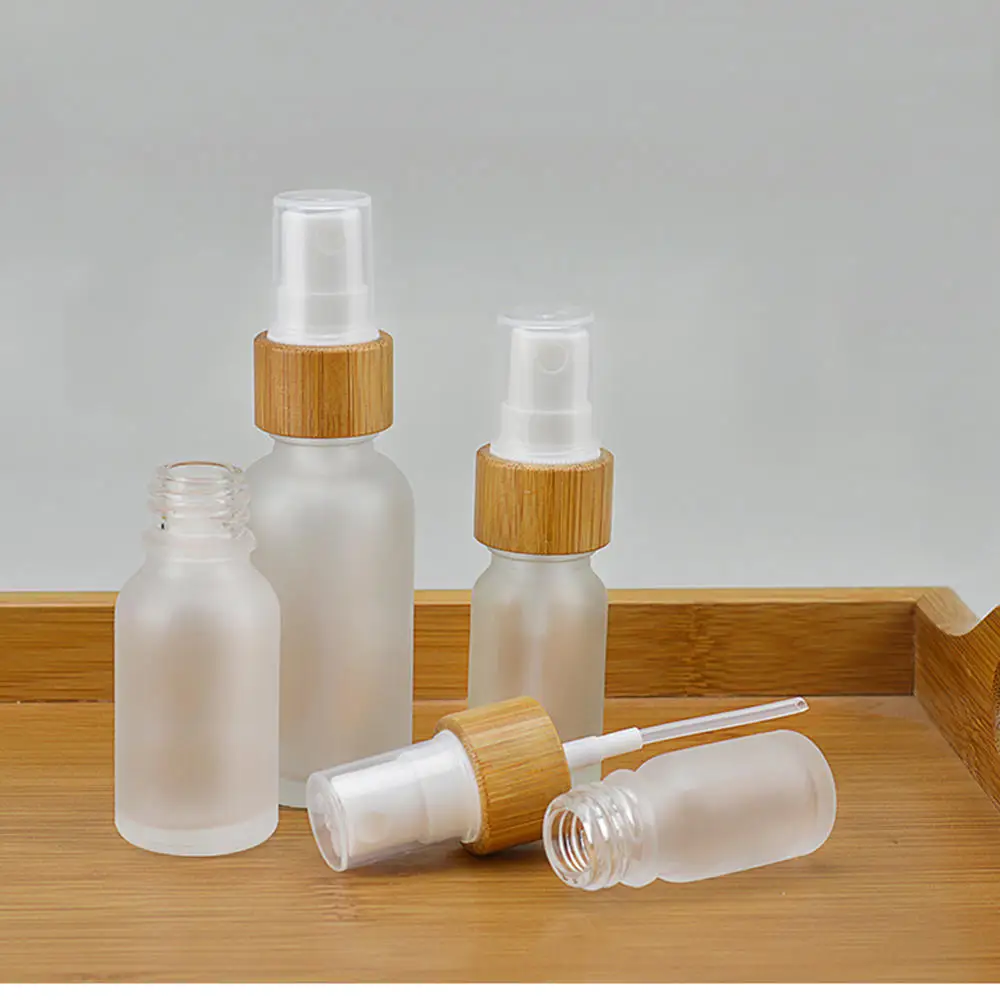 

Refillable Empty Frosted Glass Spray Bottle With Natural Bamboo Lid Pump Head Travel Perfume Liquid Cosmetic Vials Containers