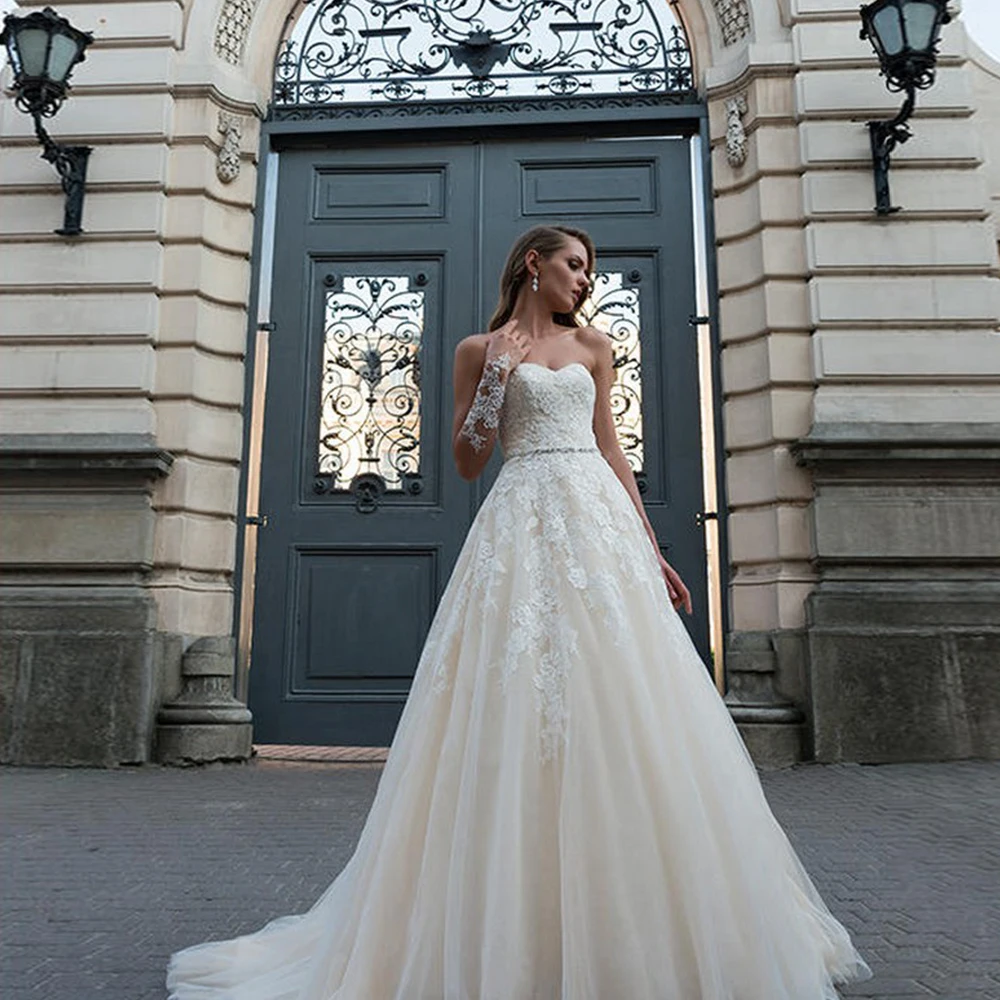 

A-Line Tulle Strapless Wedding Dresses Appliques Beading Sleeveless Backless Floor Length Bridal Gowns