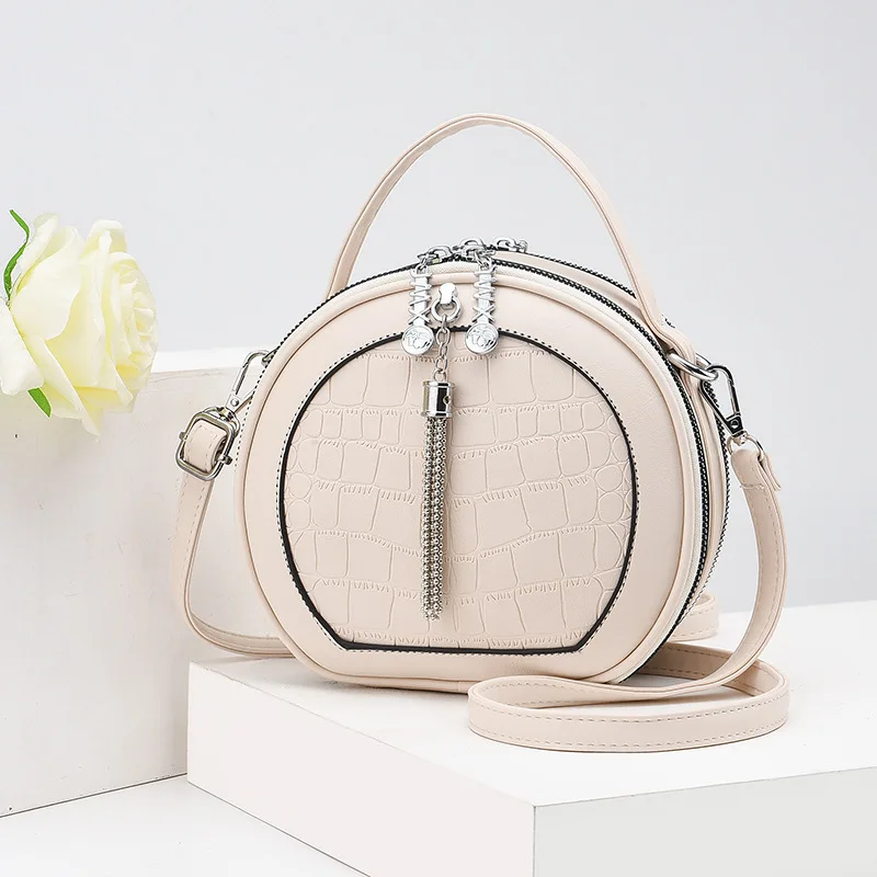 

Small bag women 2021 new fashion round women's bag single shoulder slung round cake bag portable mini round bag