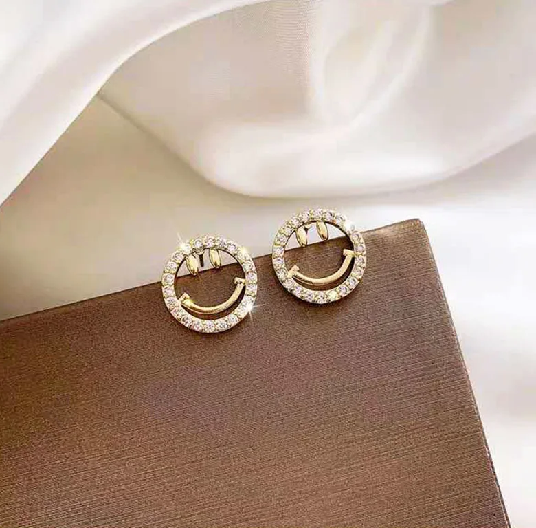 

Gaku new Korean simple and fresh zircon stud earrings summer hollow smiley face diamond personalized women jewelry