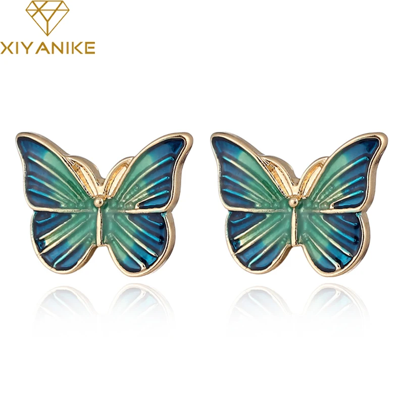 Серьги гвоздики XIYANIKE с синим капающим маслом имитация бабочки золотистые