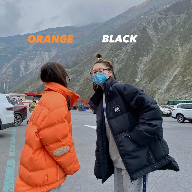 

The new down jacket thickened men and women with the same paragraph couples short stand-up collar white duck down Korean wave