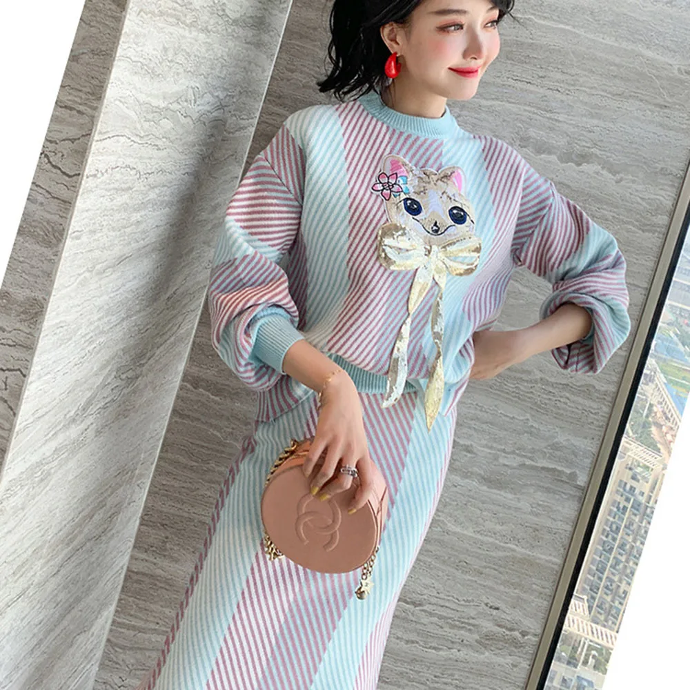 

Осенне-зимний новый тонкий вязаный комплект из двух предметов, женский свитер с мультяшным принтом, топ, вязаная юбка, свободный женский кос...