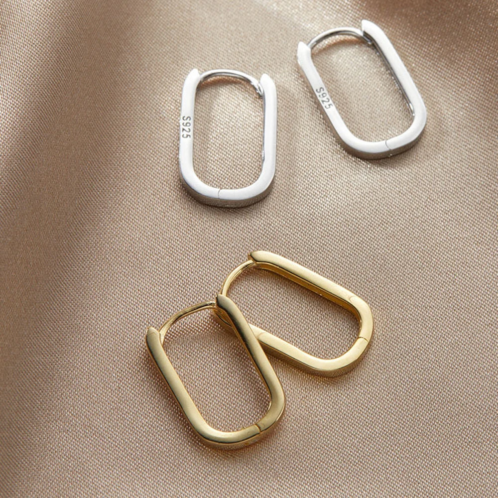 Серьги-кольца женские с геометрической застежкой золотого цвета из металла