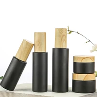 1pc matte black glass bottle travel eye cream lotion cosmetic container spray bottle with wood grain lid skin care tool