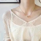 Корейская версия из нержавеющей стали покрытая розовым золотом Женская бижутерия карманные мини-наручники Женское Ожерелье Подвеска Аксессуары