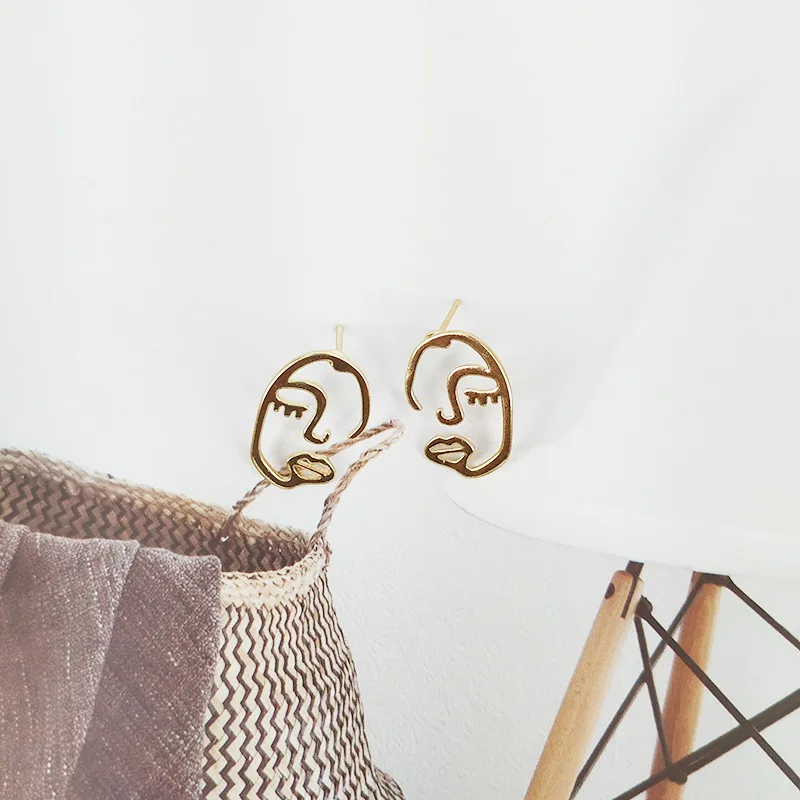

Dream Candy 2 Hollow Human face Earring for Women Gold Metal Trendy Earrings Creative Stud Earrings Accessories Modern Jewelry