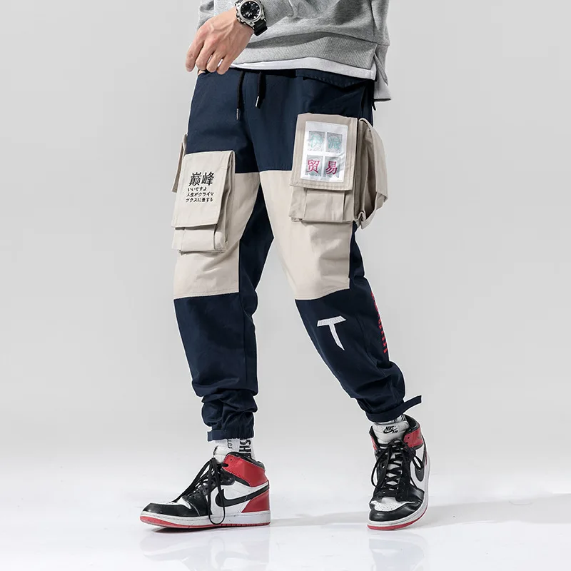 

Мужские брюки-карго с большим карманом, с вышивкой японских букв, в стиле хип-хоп, панк, мужские шаровары, цветные, лоскутные, панталоны разме...