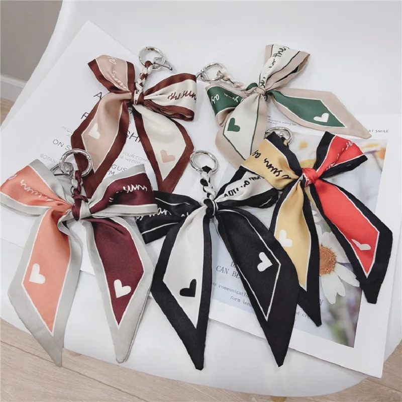 

New Web Celebrity Hand Woven Silk Scarf Bow Keychains Car Key Ring Horseshoe Button Personality Key Chain Lady Bag Pendant Tide
