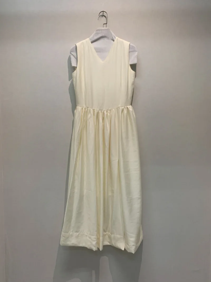 

High set low French vest and high split dress