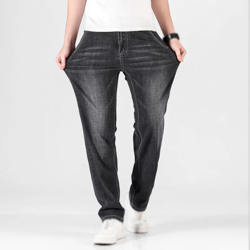 

Men's summer mid-waist straight slim fitting denim pants high elastic trousers loose casual business jeans large size 29-46