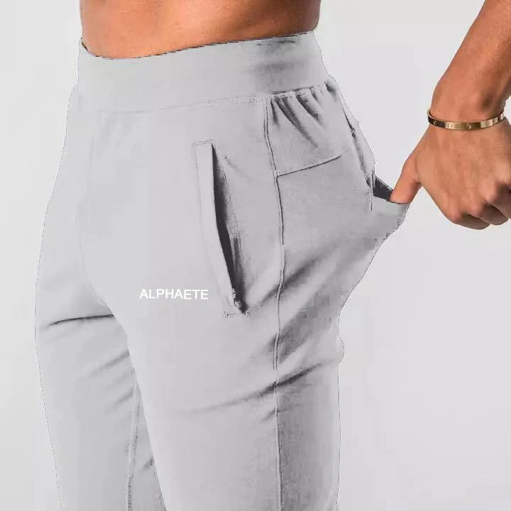 

2021 new men muscle fitness running training sports cotton trousers men's breathable Slim beam mouth casual health pants Male