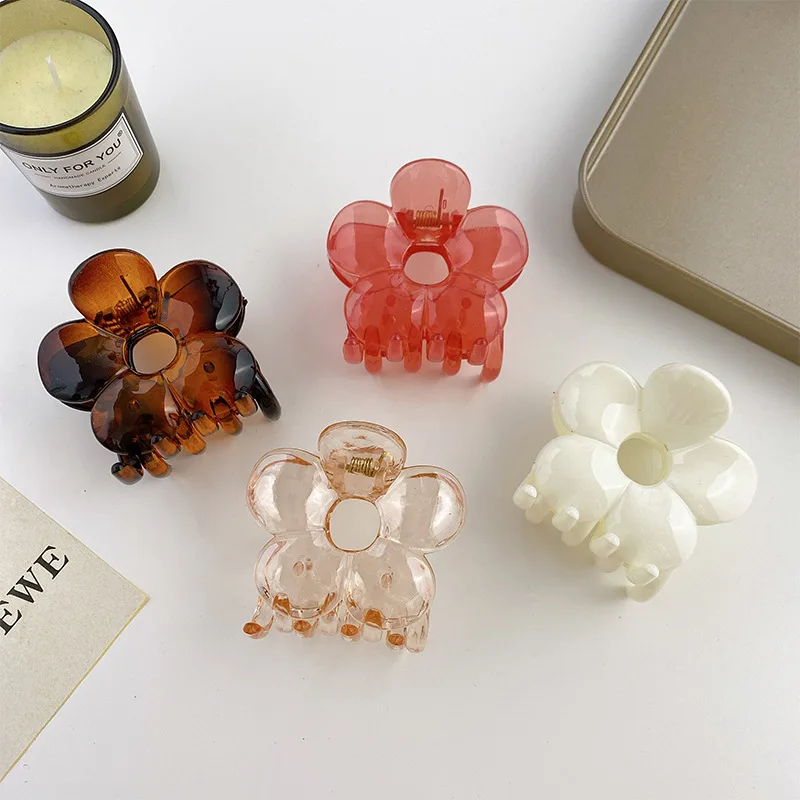 

INS Hot Selling Glossy Hollow Flower Shape Hair Clip Teen Girls Simple Amber Transparent Plastic Hair Clip Claw For Girls