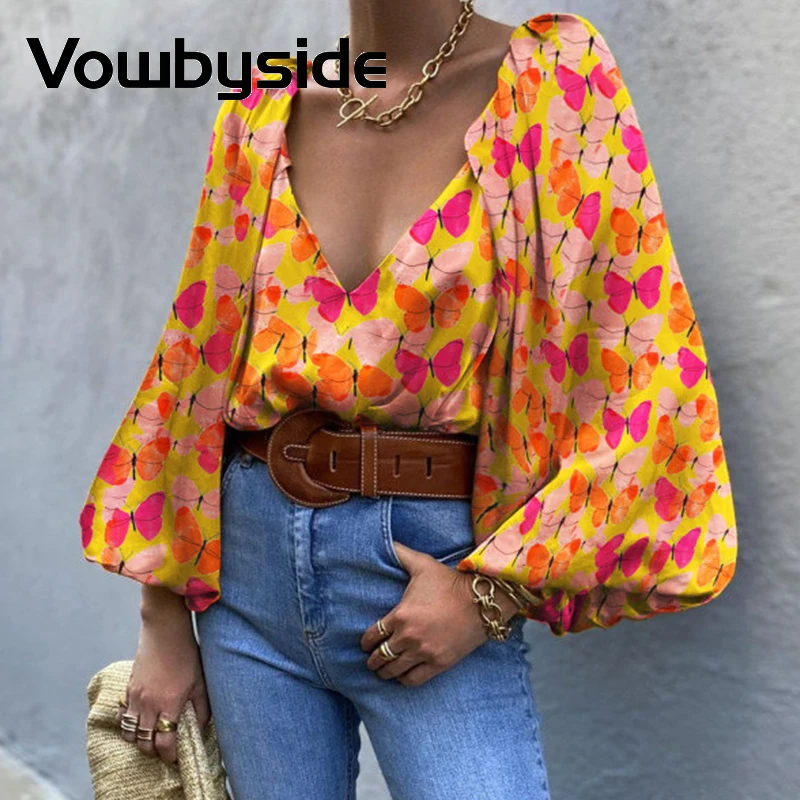 

Женская винтажная блузка с рукавами-фонариками и глубоким V-образным вырезом