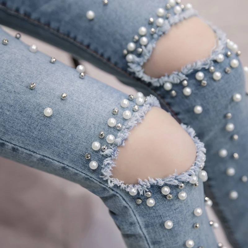 Женские джинсовые брюки с перламутровыми вставками повседневные рваные