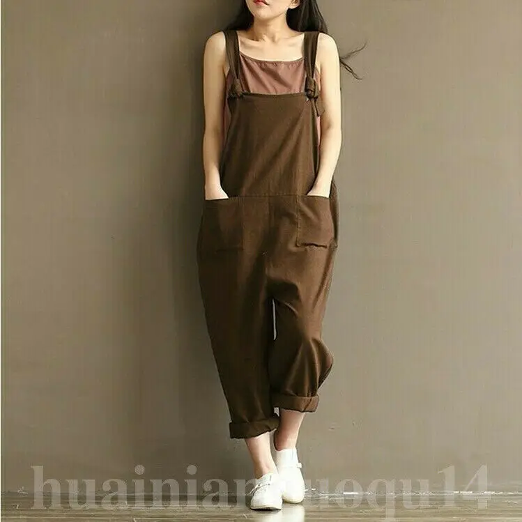 Женский комбинезон с широким вырезом V-образным, коротким рукавом, длинными льняными брюками и ремешком на широких лямках.