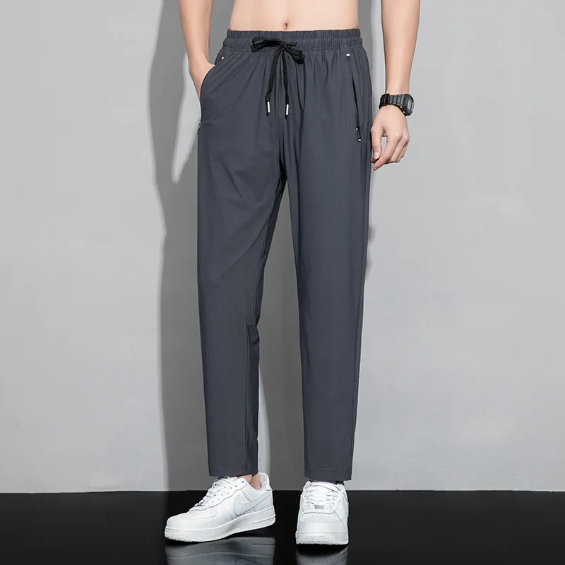 

2021 summer thin ice silk pants men's breathable air conditioning pants trend sports pants large casual Leggings Capris
