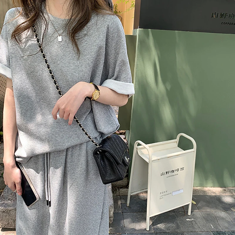 

DEAT 2021 New Spring And Autumn Fashion Casual Loose Short Sleeve Sweater + Skirt Casual Loose Two Piece Set Women SL636