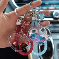drop shipping creative acrylic into the oil bottle quicksand love keychain flash peach heart car key chain bag pendant