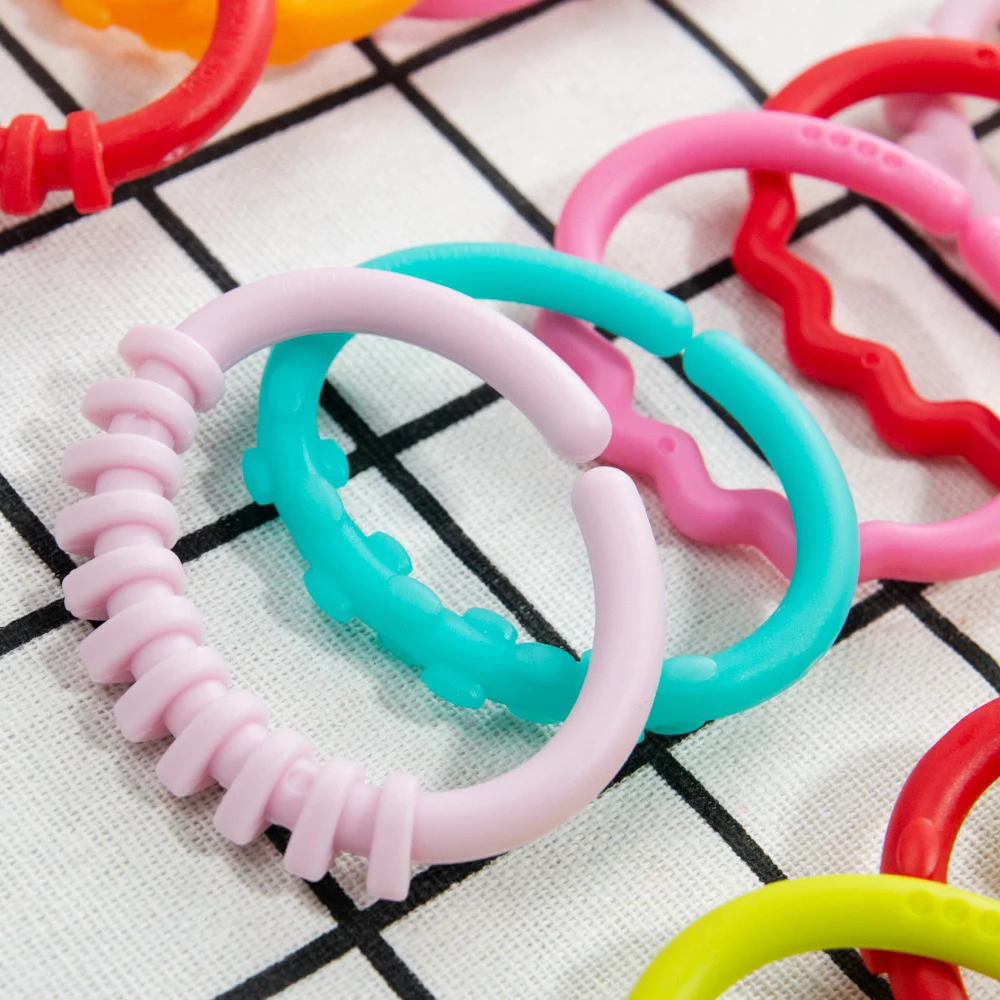 

6pcs/set Plastic Rainbow Ring Baby Toys Baby Teether Pacifier Newborns Rattles Rubber Crib Toys Stroller Hanging Toy Room Decor