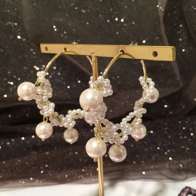

Pearl tassel earrings with sweet personality and elegant winding circle earrings