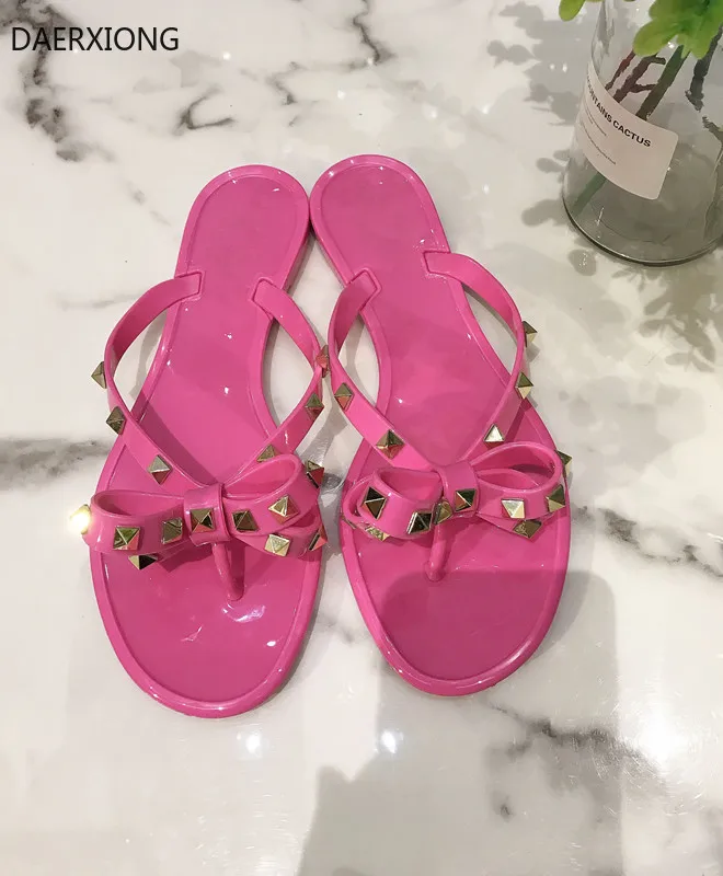 

2021 V style High-End Riveting Nail Bowknot Flat Slipper Summer Beach Slippers Leisure PVC Jelly Shoes with right logo