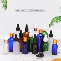 wholesale custom empty unique essential oil bottles 15ml 30ml 50ml hair oil glass dropper bottles amber green blue black clear