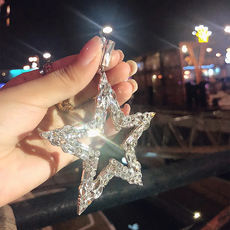 

Серьги-подвески с крупными звездочками и фианитами, 1 шт.