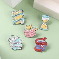 cartoon book enamel pins yellow blue cat hourglassbrooches custom badge decoration backpack caps gift for reader writer jewelry