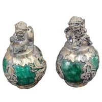 a pair of antique bronze lions and silver coated jade