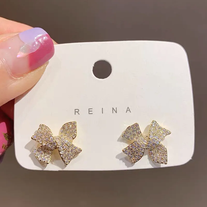 

Korean Ins Temperament 925 Silver Needle Simple Full Diamond Bow Knot Minority Design Sense Small Earrings Female