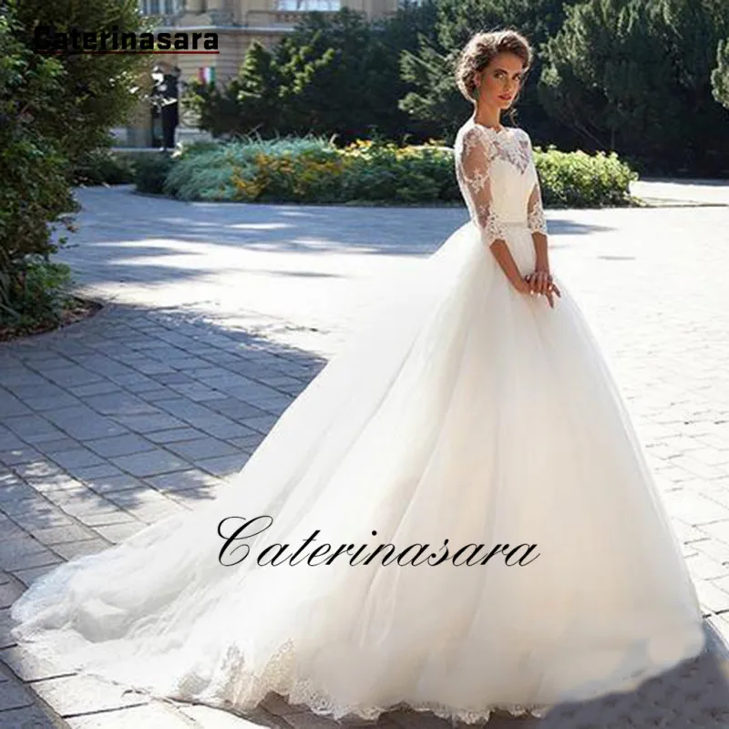 Кружевное свадебное платье цвета слоновой кости со стразами поясом тюлевым