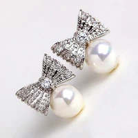 huitan chic bowknot imitation pearl stud earrings for women simple stylish accessories versatile party daily wear trendy jewelry