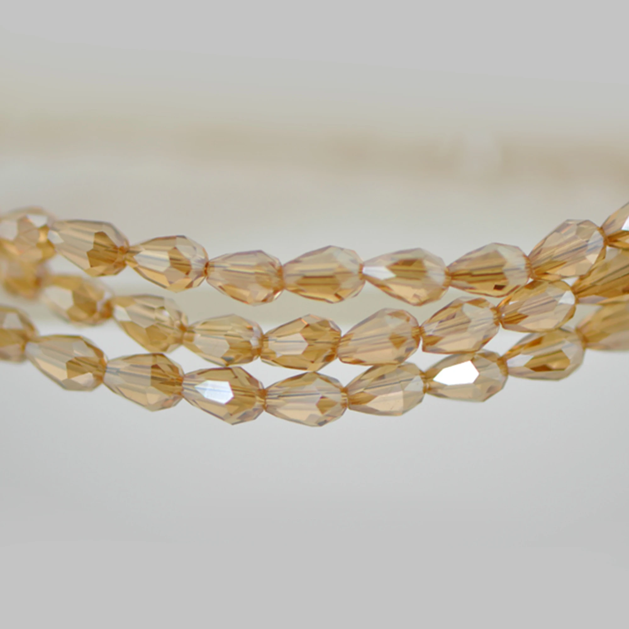

Teardrop Crystal Glass Faceted Beads 3x5mm Champagne -SS03-09 /95pcs