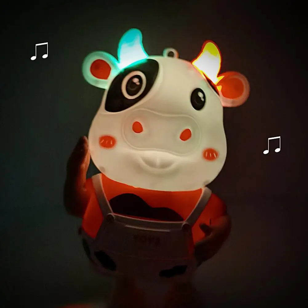 

Милая музыкальная электрическая светящаяся танцевальная детская игрушка в виде молочной коровы