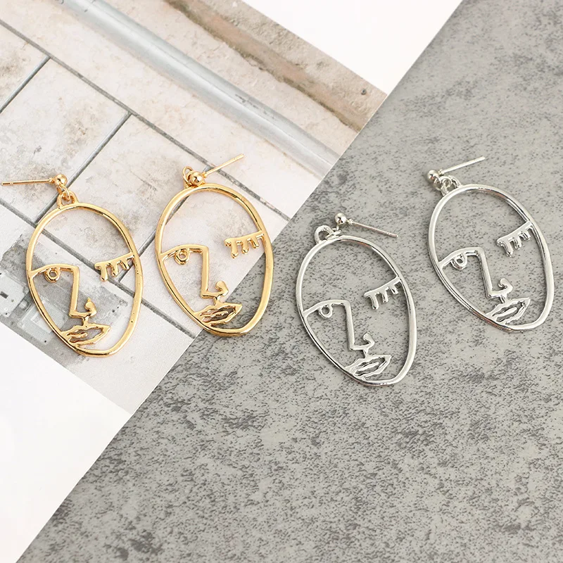 

Hollow Abstract Human Face Stud Earrings