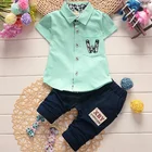 Детский летний костюм, оптовая продажа 2021, летний хлопковый комплект из двух предметов для мальчиков и девочек с коротким рукавом и мультяшным рисунком, комплект одежды для маленьких мальчиков