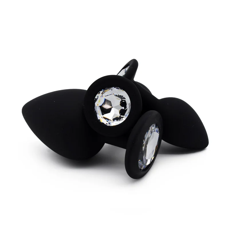 Силиконовые анальные пробки и вибратор фаллоимитатор с украшением в виде