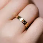 Кольцо женское, золотого цвета, с перфорацией, со звездами