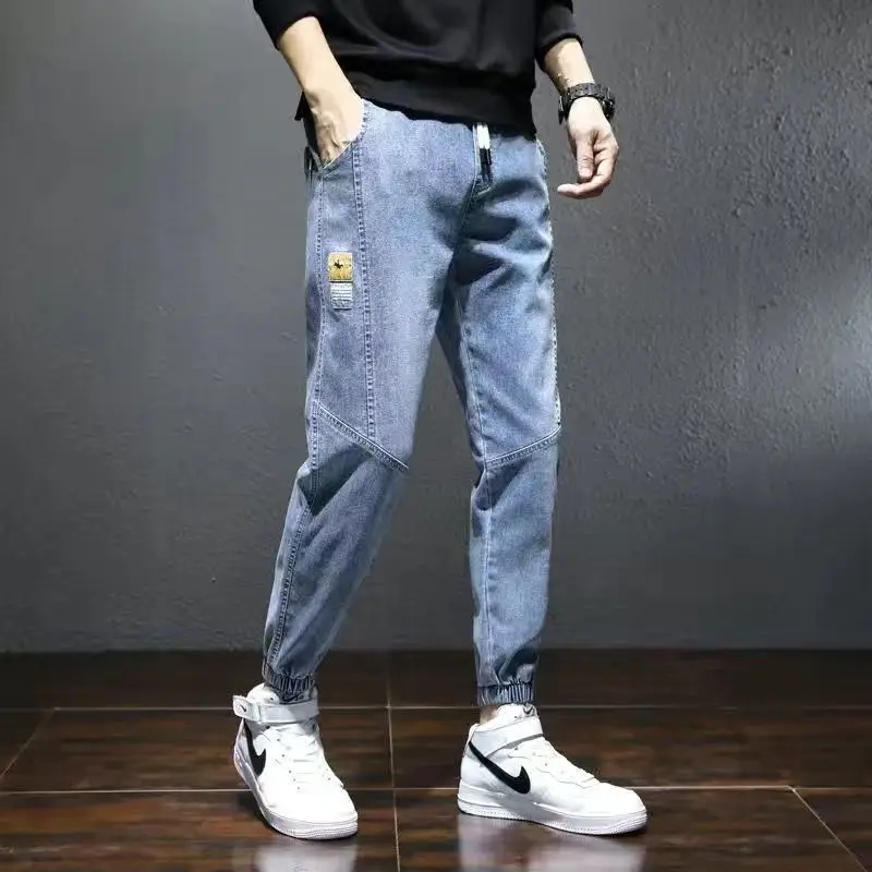 

2021 Spring and Autumn New Solid Color Men's Trendy Brand Loose Nine-point Tooling Casual Tie-feet Men's Patchwork Jeans