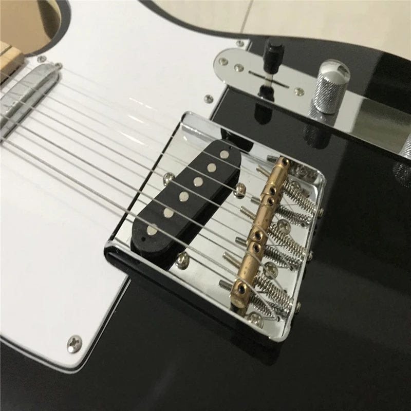 

black tele guitar,gold bridge hardware.double white binding tele guitar in stock free shipping Chinese guitar