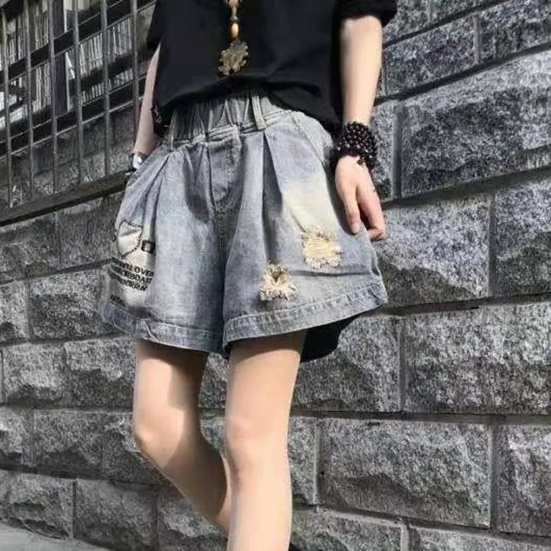 

New Summer European Style Women Loose Casual Embroidery Cotton Denim Wide Leg Pants Elastic Waist Knee Length Ripped Jeans W130