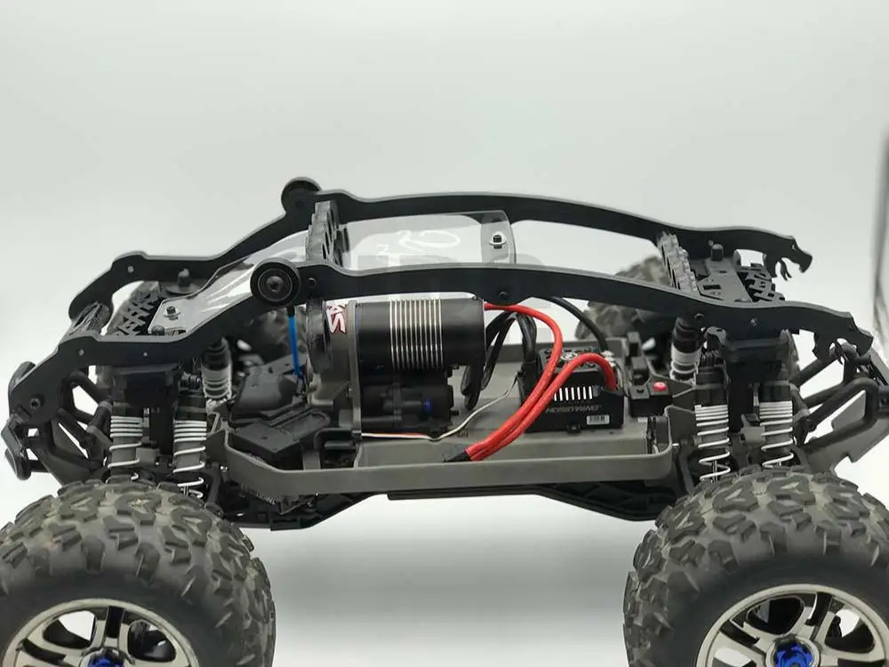 Traxxas e maxx. Traxxas e maxx brushless. корпус на traxxas e maxx. радиоуправляемые машины maxx traxxas 1/10 оранжевый.