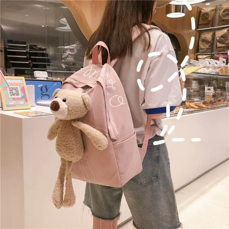 

Creative cute doll decoration lovely sweet girl backpack college style casual versatile solid color student schoolbag