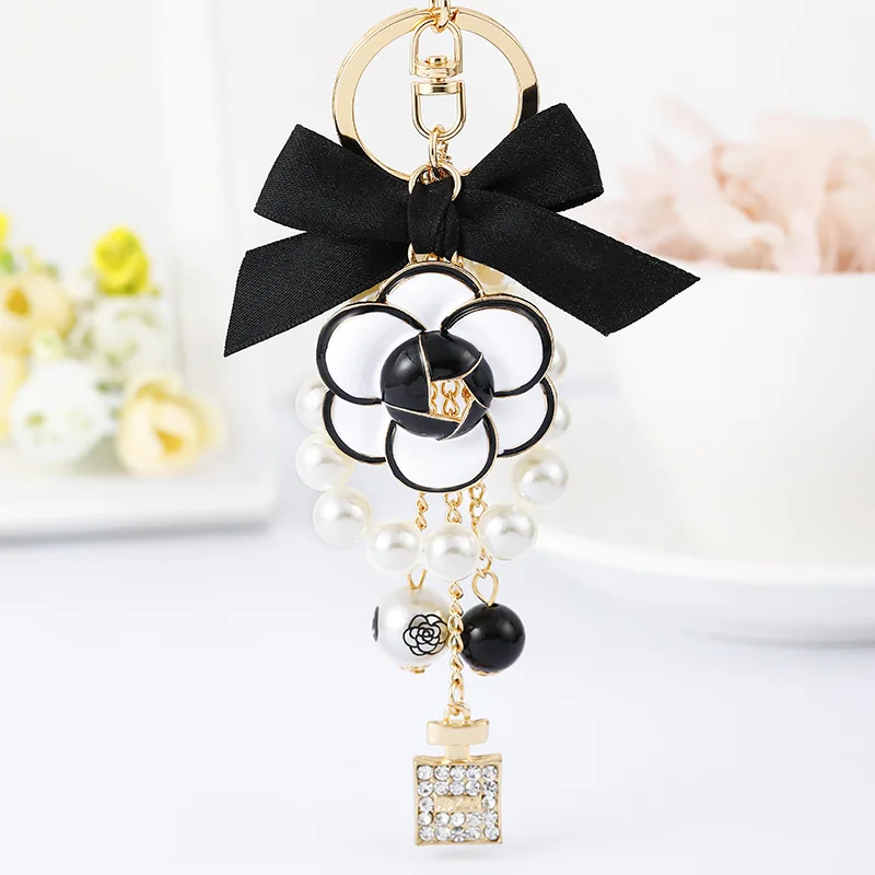 

New Korean Flower Keychain Crystal Perfume Bottle Keychain Pendant Bowknot Pearl Keychain Fashion Woman Girl Bag Ornament Gift